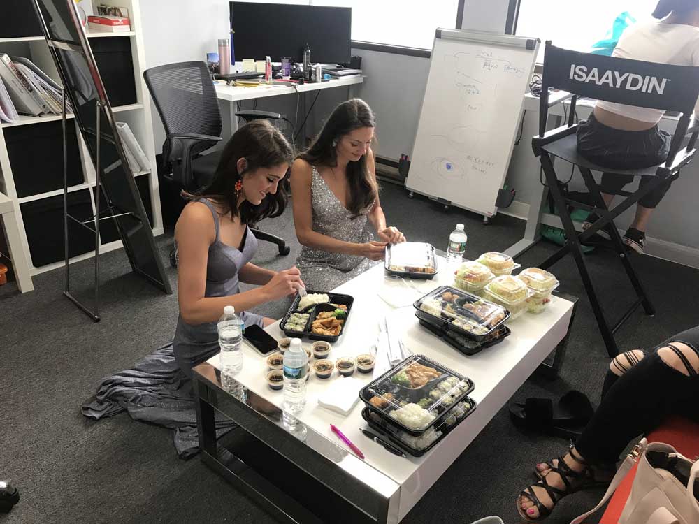 Behind the scenes with models during dresses photoshoot